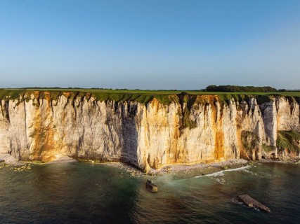 Aerial view of rugged chalk cliffs in the evening sun, Étretat, Alabaster Coast, La Côte d'Albâtre,
