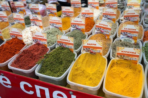 A variety of colorful spices in plastic containers with detailed signs, Pia?a Centrala, Piata
