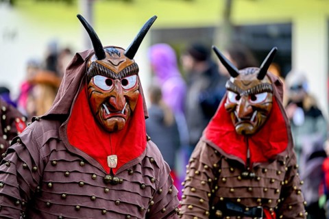 Members of a fools' guild in traditional Haes, fools' clothes, during the carnival procession in