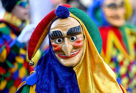 Member of a fools' guild in traditional Haes, fools' clothes, during the carnival procession in