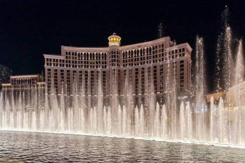 Bellagio fountains dancing in front of the hotel at night, Las Vegas, Nevada, United States of