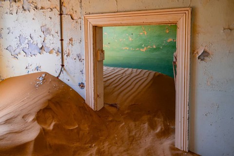 Interior view, doors and house full of sand, former diamond mining town, Namib Desert, Kolmanskop,