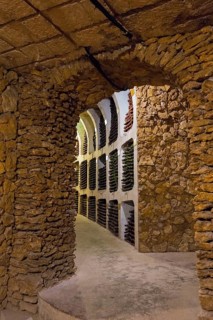 Cosy wine cellar with stone walls and bottle racks in a cave-like room, wine cellar, Milestii Mici