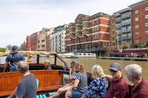 Passengers onboard boat trip on the Floating Harbour, River Avon, Bristol, England, UK
