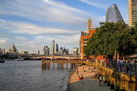 Sandy beach beach on the banks of the Thames near Gabriel's Wharf with views of Blackfriars Bridge