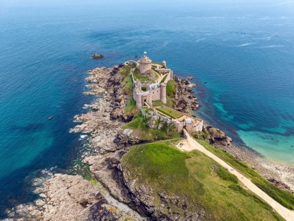 Aerial view of the historic rock castle Fort la slat, Château de la Roche Goyon on a rocky headland
