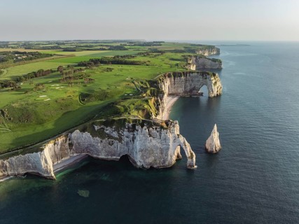 Aerial view of the Porte d'Aval rock formation in the evening sun, well-known sights on the chalk