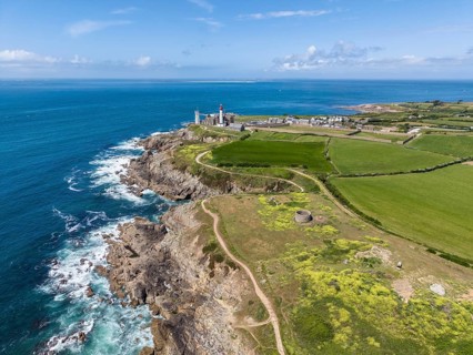 Aerial view of the distinctive red and white lighthouse Phare de Saint-Mathieu on the Breton coast