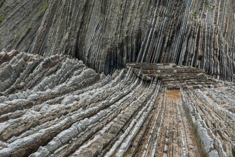 Geological formation of sandstone and limestone layers, Flysch on Itzurun Beach in Zumaia, Spain