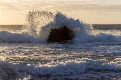 Lanzarote, Canary Islands, Spain, Europe, Los Hervideros, Big waves break against rocks at sunset