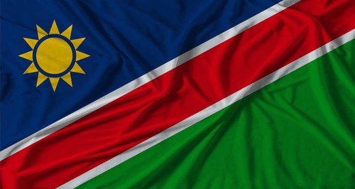 Namibia flag with fabric texture background. National flag of Namibia with cloth texture