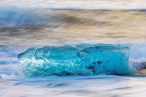 Ice chunks on the black beach, lava beach, glacier ice, sea, winter, sunset, Diamond Beach
