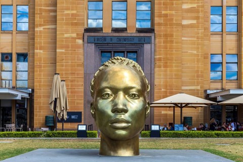 A bronze sculpture head named Ancient Feelings by Thomas J Price outside the Museum of Contemporary