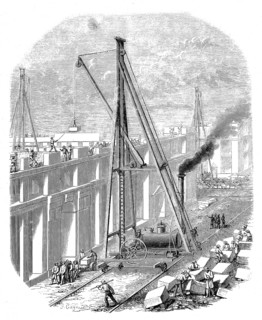 Mobile steam crane used to lift heavy stone blocks on a construction site in the 19th century. At