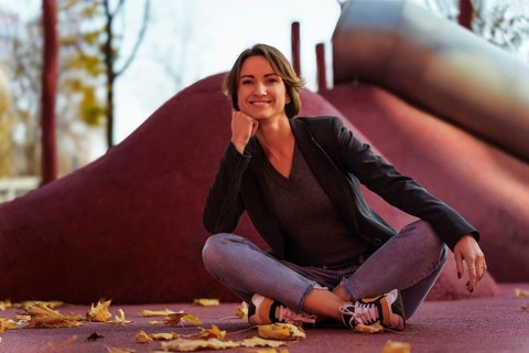 Young woman enjoying autumn at the playground