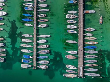 Marina of the Yacht Club Insel Reichenau. The lake bed can be seen in many shallow water zones. The