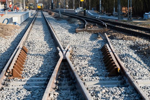 A newly installed railway switch (points) on a railroad line under reconstruction, filled with
