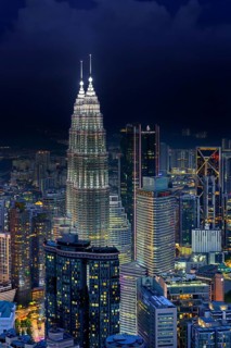 Petronas Towers, KLCC Twin Towers, interlinked 88-storey supertall twin skyscrapers illuminated at