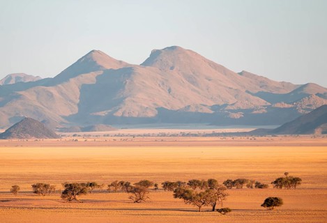 Dry landscape in the NamibRand nature reserve, behind Naukluft Mountains, Namib Desert, Namibia
