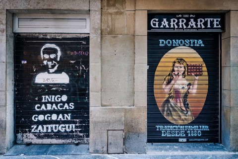 Typical Spanish art graffiti at a shop in the old town of San Sebastian, Spain