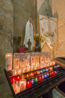 Burning commemorative candles in a church