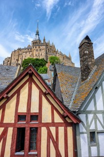 Medieval alley and traditional half-timbered houses within the fortress walls of Mont-Saint-Michel.