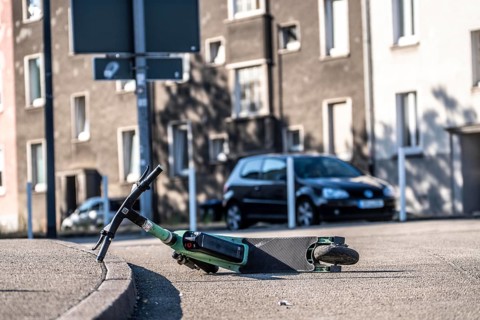 Rental scooter, e-scooter, left at the sidewalk, in Essen, North Rhine-Westphalia, Germany