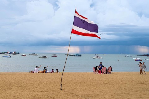 Sandy beach beach and Thailand flag, Pattaya, Thailand