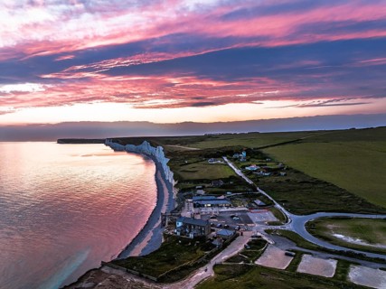 Sunset over Seven Sisters Cliffs from a drone, English Channel, East Sussex, South-east England