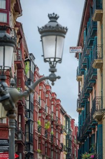 Row of houses with typical street lights in the old town of Bilbao, Basque Country, Spain