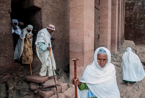 Faithful getting out of a rock hewn church at Lalibela, Ethiopia. Major centre of the orthodox