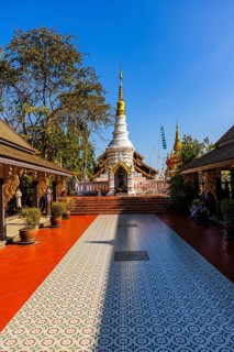 Chedi white temple tower, stupa, in the Wat Phra That Don Phra Chan Buddhist temple, near Lampang,