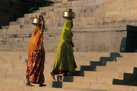 Women carry stuffed water balls on their heads at Gadsisar Lake, Jaisalmer, Rajastan, India