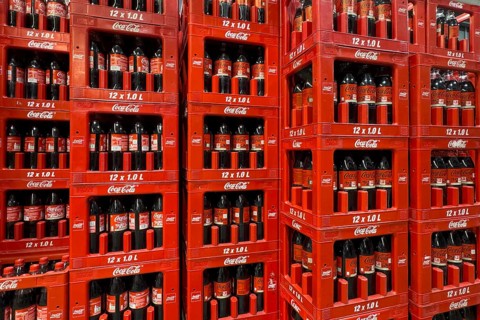 On the left two rows in boxes 1 liter PET bottles recyclable plastic containers polyethylene