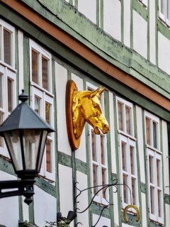 Golden horse head on a half-timbered house in Keßlerstraße, Hildesheim, Germany
