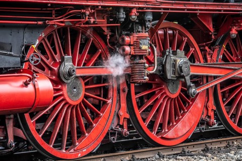 Detailed view of the drive wheels and coupling rods of a steam locomotive, Bochum railway museum,