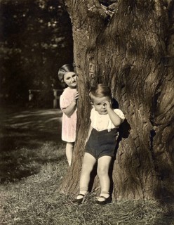 Boy and girl posing at a tree, summer, siblings, historical, 1940s, Germany