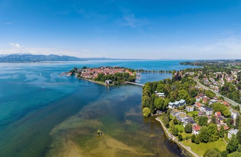 Aerial view of the city of Lindau and Lindau Island in Lake Constance, the Swiss Alps on the