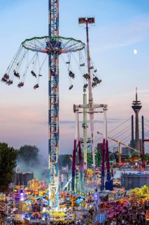 Rhine fair in the Rheinwiesen in Düsseldorf-Oberkassel, view towards the Rhine Tower,