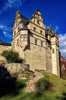 Side view of a castle with a staircase leading to the walls and towers, The Upper Castle of