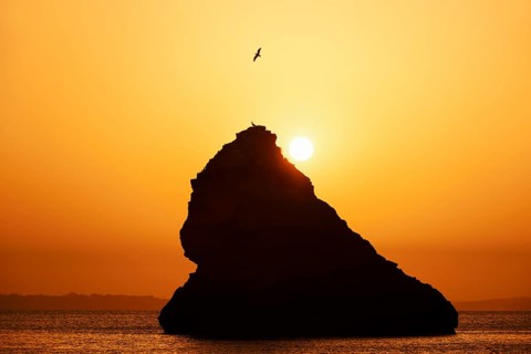 Rocks in the sea at sunrise, Praia Dona Ana, Lagos, Algarve, Portugal
