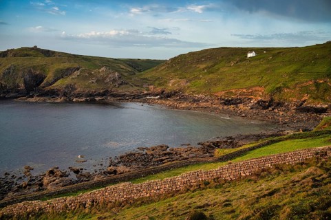 Stone wall at Cape Cornwall, in the background remains ruins of tin mine, copper mine, mine,