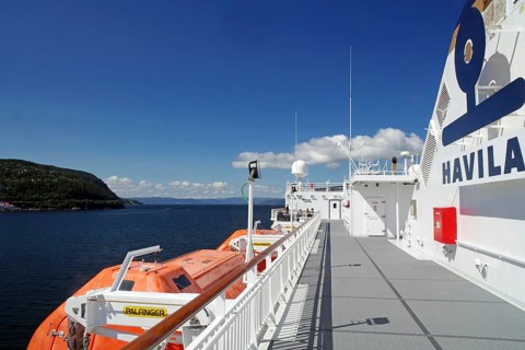 A modern ship deck with lifeboats under a clear blue sky, Havilla, mail ships, Trondheim, Norway