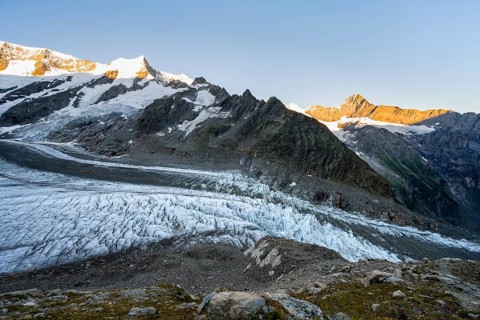Impressive high-alpine landscape, Eiger mountain summit with alpine glow at sunrise, Upper Arctic