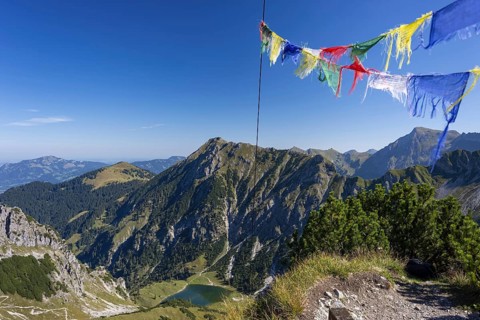 Panorama from the summit of Geissalphorn, 1953m, prayer flags flying at the summit cross, Unterer
