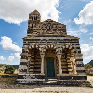 Distinctive black and white striped limestone and basalt façade, Santissima Trinità di Saccargia