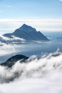 Mountain landscape and sea, view from Stornappstinden summit over sea of clouds, Lofoten, Nordland,