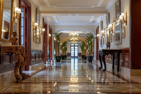 Hallway with marble floor, chandeliers and paintings on the walls, The Imperial New Delhi, Janpath,