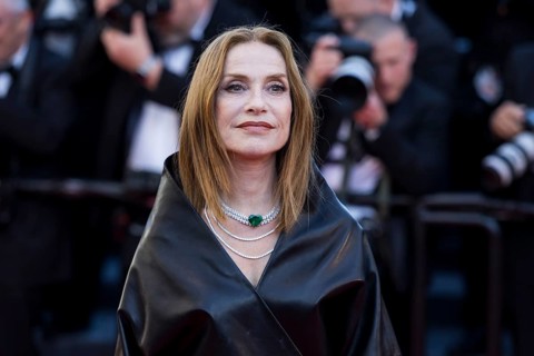 Isabelle Huppert with Karma on the Red Carpet at the Palais des Festivals et des Congrès during the