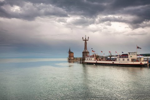 22.05.2022: Passenger ship Konstanz docked by the Imperia statue and historic gauge house under
